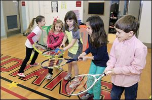 Practicing the ‘passing the worm drill’ are Lacey Powell, left, first grade; Allison Shadle, kindergarten; Justice George, second grade; Lucy Murra, second grade, and Lucas Dake, second grade. 