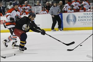 Toledo's Nick Parillo takes a shot in Sunday's alumni game against Fort Wayne at the Huntington Center. The Toledo alumni won 9-8 in a shootout as Parillo got the game-winning goal.