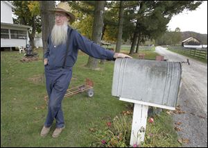 Sam Mullet is seen outside his home in Bergholz, Ohio.