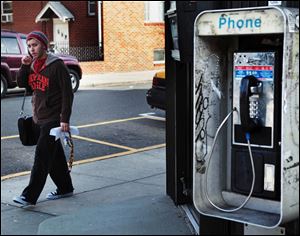 Dave McClelland, of Guttenberg, strolls along Bergenline Avenue at the North Bergen-Guttenberg border with a cellphone pressed to his ear.