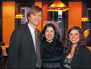 Left to right Nick Hall, his wife Jennifer Hall, and Erin McPartland during Graham's Foundation Power to Grow fundraiser Mancy's Steakhouse.