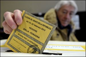 A man casts his vote for the Italian Senate, in Piacenza, Italy, Sunday.