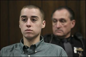 T. J. Lane listens during court proceedings in Geauga County Common Pleas Court today in Chardon, Ohio.