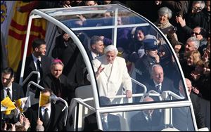 Pope Benedict XVI greets pilgrims in St. Peter's Square at the Vatican, today, for the final time before retiring, waving to tens of thousands of people who have gathered to bid him farewell.