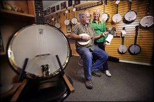 Founders Greg and Janet Deering stand in the showroom at the Deering Banjo Co., the best-selling banjo-making business in the United States. The company has expanded its work force and expects to top $4 million in sales for the year ending June 30.