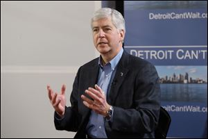 Gov. Rick Snyder remains coy about who he would choose as an emergency manager of Detroit's failing finances.