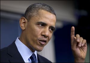 President Obama gestures as he speaks to reporters in the White House briefing room in Washington, Friday, following a meeting with congressional leaders regarding the automatic spending cuts.