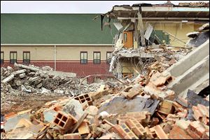 The new DeVeaux school sits next to the remnants of the old building. The massive TPS building project was part of a statewide push to overhaul Ohio's schools. In 2002, local voters approved a 4.99-mill, 28-year levy to supplement state money from tobacco settlement funds.