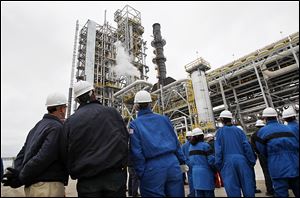 Workers and guests gather at BP-Husky Refining LLC in Oregon for a commissioning ceremony for a $400 million gasoline processing unit known there as Reformer 3. The unit went online about a month ago.