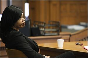 Melody Williams listens to Ian English, an assistant Lucas County prosecutor, during closing arguments. Williams was convicted on all counts in the murder of L.C. Lyons, Jr., of Sylvania Township.