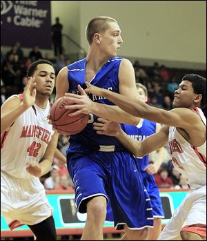 Mansfield Senior's Donovyn Benson, left, and Mario Davison try to defend Anthony Wayne’s Mark Donnal, who led the Generals with 20 points. Three teammates joined him in double figures as Anthony Wayne advances to play Rogers on Thursday at 7 p.m. at Toledo’s Savage Arena.