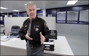 Sheriff John Tharp speaks about how crowded it gets in the booking area at the Corrections Center.