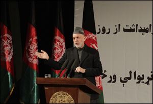 Afghan President Hamid Karzai speaks during a nationally televised speech about the state of Afghan women in Kabul, Afghanistan, today.