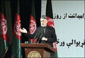 Afghan President Hamid Karzai holds a news conference in Kabul on Sunday in honor of  Women’s Day. He later met privately with Defense Secretary Chuck Hagel, who is making his first official visit there.