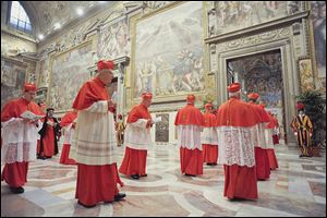 Cardinals enter the Sistine Chapel to begin the conclave that will choose a successor to Benedict XVI, Pope Emeritus. Cardinals from around the globe locked themselves inside the Sistine Chapel on Tuesday to choose a new leader.