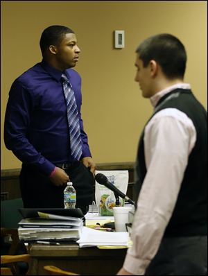 Ma'lik Richmond, 16, left, and co-defendant Trent Mays, 17,  right, walks around in the court room during a break Saturday in Steubenville.