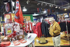 Jerry Reiter of Toledo shops at The Buckeye Store and More! Manager Al Luna said his store sees a 10 to 15 percent increase during March Madness.