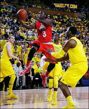 Ohio State sophomore Shannon Scott drives the lane against Michigan. Scott was voted to the  All-Big Ten defensive team. His father, Charlie, was the first African-American scholarship athlete at North Carolina and won and NBA title when he played for the Boston Celtics.