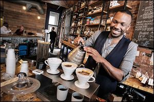 Ryan Barrett makes pour-over coffee at Great Lakes Coffee Roasting Co., which opened on Woodward Avenue in July.