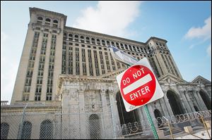 The Michigan Central Station sits desolate in Detroit, the most conspicuous of the city’s thousands of derelict buildings.