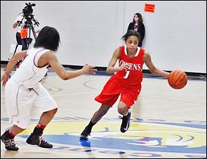 Owen's Uniqua Mitchell drives past a Lake Michigan defender in Saturday's 7th place game of the NJCAA D-II national tournament. Mitchell had a team-high 17 points in the loss.