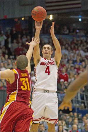 Aaron Craft shoots the game-winning 3-point shot over the outstretched hand of Iowa State's Georges Niang. The Buckeyes will now play Arizona in Los Angeles in the Sweet 16.