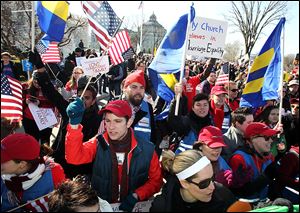 Supporters of marriage equality gather outside the U.S. Supreme Court, where justices heard the challenge to California’s Proposition 8, a ballot initiative that overturned the state’s same-sex marriage law.