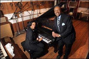 Robin R. Terry, left, chairman of the Board of Trustees of Motown Museum, and Interim Motown Museum CEO Allen Rawls pose for a photo with the prized 1877 Steinway grand piano.