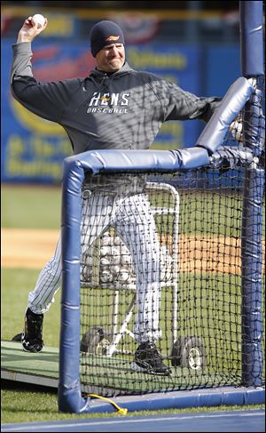 Mud Hens pitching  coach A.J. Sager throws batting practice at Fifth Third Field. Sager, who spent five years in the majors, is in his sixth season in Toledo. 