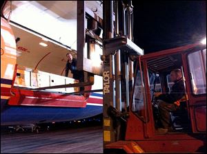 Workers use a forklift to remove a giant saltwater crocodile from a cargo plane as it arrived at Toledo Express Airport on Friday. The crocodile was shipped in a box and was taken to the Toledo Zoo.