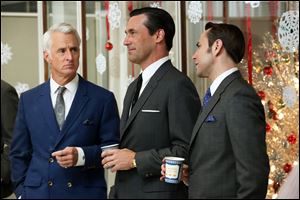 John Slattery as Roger Sterling, left, Jon Hamm as Don Draper, center, and Vincent Kartheiser as Pete Campbell in a scene from the season six premiere of 