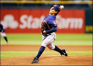 Indians starting pitcher Trevor Bauer fires a pitch during his debut with Cleveland against Tampa Bay. Bauer struggled with his control Saturday and walked seven batters in five innings.