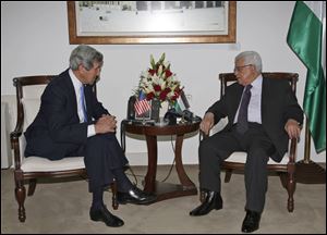 Palestinian President Mahmoud Abbas, right, meets Sunday with U.S. Secretary of State John Kerry in the West Bank city of Ramallah.