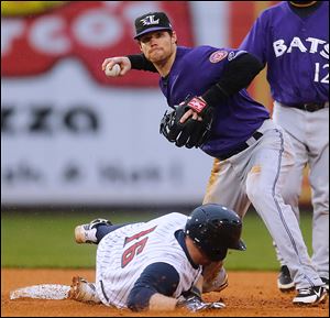 Mud Hens catcher Bryan Holaday is forced out at second base, the start of a double play turned by Louisville Bats shortstop Jason Donald in the sixth inning Thursday. The Mud Hens lost 4-1.