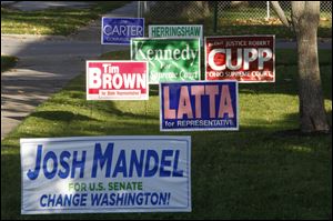 City council has been discussing a change to its temporary sign code since resident Daniel Greenberg challenged the constitutional validity of the sign code ordinance in July. He was cited for displaying an Obama sign outside of the constraints of 70 days before an event and seven days after. The city is in litigation with Mr. Greenberg.