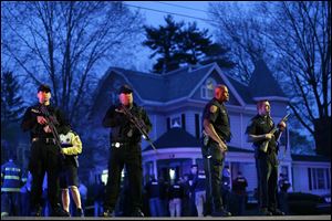 Gunfire erupted tonight amid the manhunt for the surviving suspect in the Boston Marathon bombing, and police in armored vehicles and tactical gear rushed into the Watertown neighborhood.