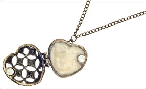 The interior of a heart locket housing processed breast milk.