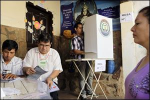 A man votes in general elections outside Asuncion, Paraguay. Exit polls Sunday showed the Colorado Party, led by tobacco magnate Horacio Cartes, with a wide lead. The elections were a step toward repairing global relations after the swift impeachment of President Fernando Lugo led to sanctions. 