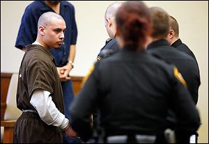 Antonio Cervantes is led away by deputies after he was sentenced in Lucas County Common Pleas Court on Tuesday.