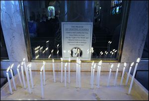 Candle lighting for prayer at Holy Trinity Greek Orthodox Cathedral.