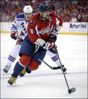 New York Rangers center Brian Boyle, left, chases Washington Capitals left wing Alex Ovechkin.