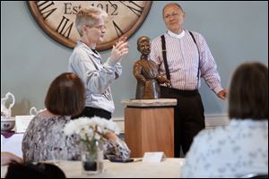 Sculptor Beth Franz, left, spoke during the Unveiling Ceremony of the Claire Metzger Memorial Statue at the Monclova Community Center.