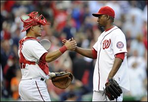 Washington Nationals relief pitcher Rafael Soriano celebrates a 5-4 win with catcher Wilson Ramos.