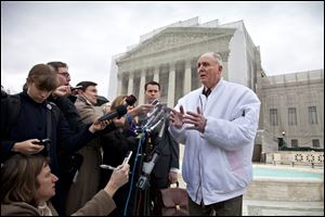 Vernon Hugh Bowman, a 75-year-old Indiana soybean farmer, speaks with reporters outside the Supreme Court in Washington.