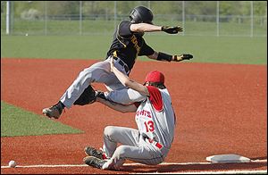 Northview's Eric Walz, top, collides with St. Francis first baseman Kenzie Mayo during their game at Mercy Field.