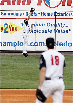 The Mud Hens Danny Dorn leaves his feet to make a catch on Thursday night at Fifth Third Field.