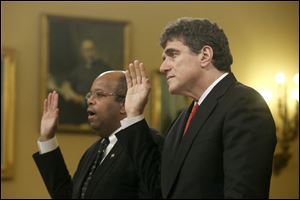 Ousted IRS chief Steve Miller, right, and J. Russell George, Treasury Inspector General for Tax Administration, are sworn in on Capitol Hill, in Washington today prior to testifying before the House Ways and Means Committee hearing on the Internal Revenue Service.