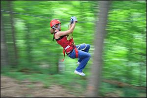 Images of Hocking Hills zip-lining. 