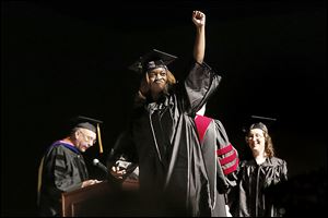 Bianca Bryant of Toledo receives her bachelor’s degree in psychology at the SeaGate Convention Centre.