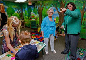 Harriet Loar, left, gets a guided tour of the new Harriet Loar Early Literacy Center from Children’s Librarian Martie Yunker at the Evergreen Community Library in Metamora, Ohio. The educational center will be open during library hours, except for the story-time hour on Wednesdays.